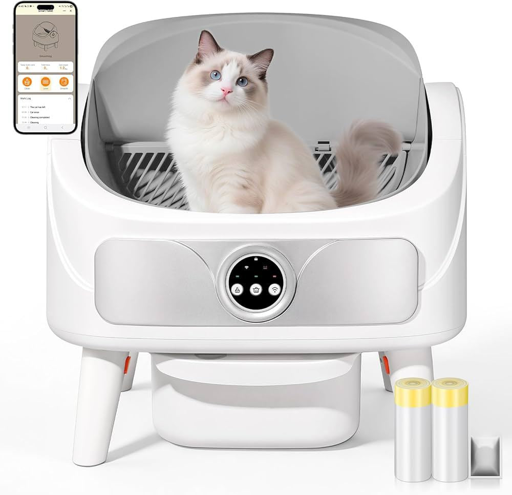 Chat assis dans la litière autonettoyante Essentielle